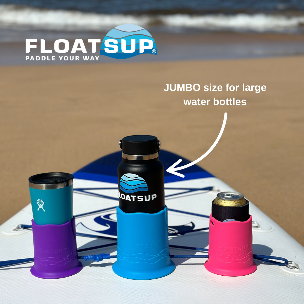 Floatsup cup holders on a paddleboard with a beach background. There is a purple one holding a thermos, a blue one golding a large reusable water bottle, and a pink one holding a can. There is text saying 'JUMBO size for large water bottles', and the Floatsup logo is shown.