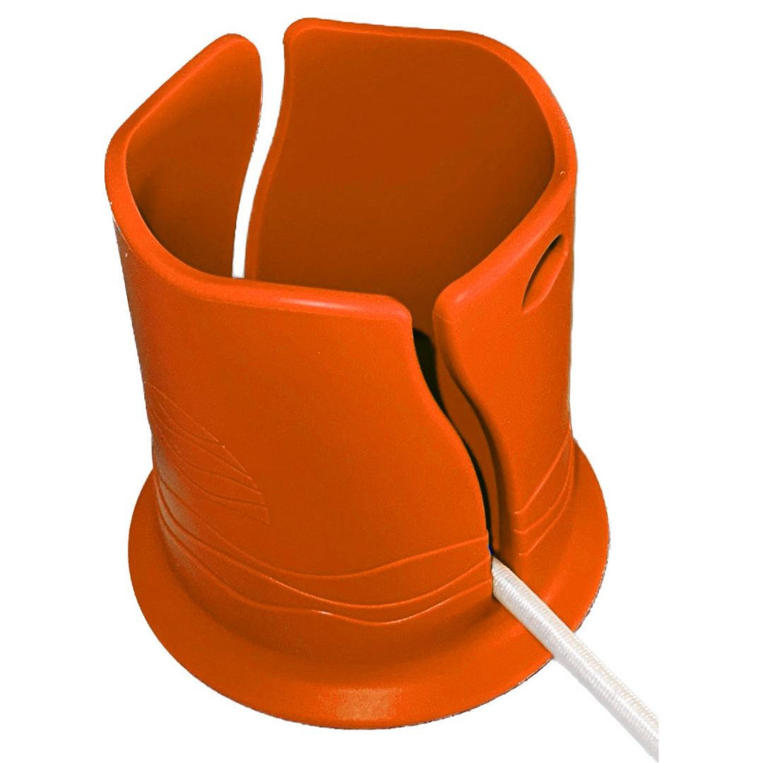 Bright orange plastic cup holder in front of a white background. It has a groove in the side for attaching it to a paddleboard or boat, with a white bungee cord shown inside the groove.