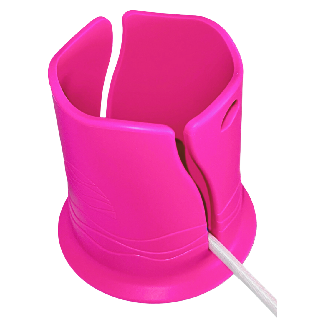 Bright pink plastic cup holder in front of a white background. It has a groove in the side for attaching it to a paddleboard or boat, with a white bungee cord shown inside the groove.